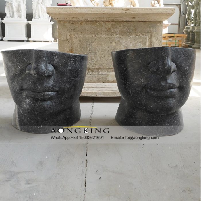 stone face chair statue