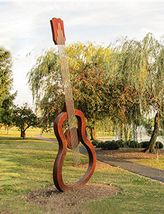 corten guitar sculpture