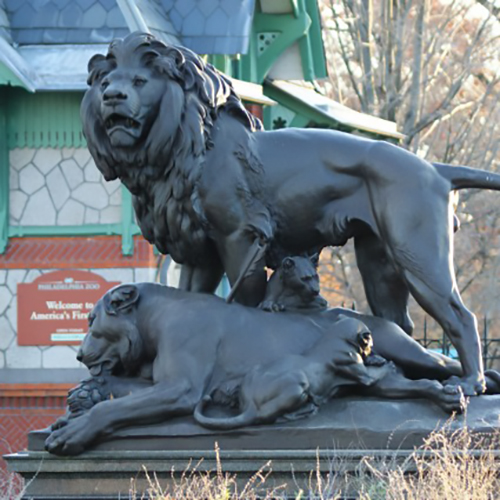 male lion dying lioness sculpture